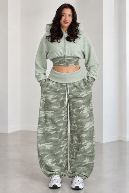 Model wearing Sage Green cropped zip hoodie and green camouflage wide-leg sweatpants set