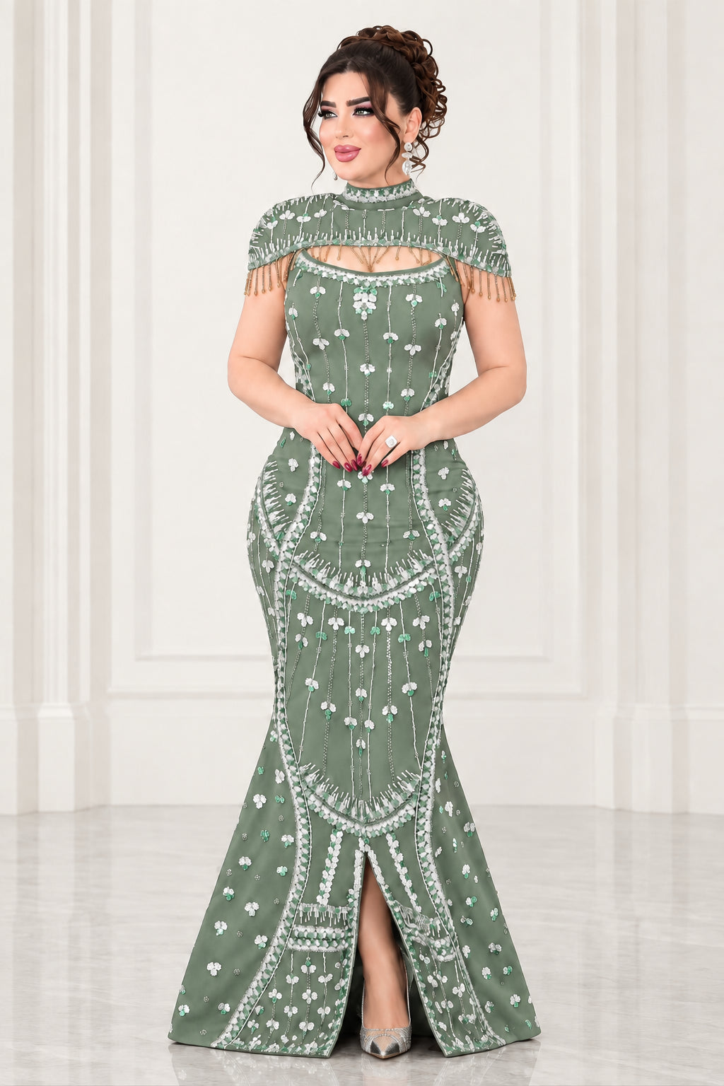 Full-length view of sage green beaded mermaid gown with front split and high neck fringe