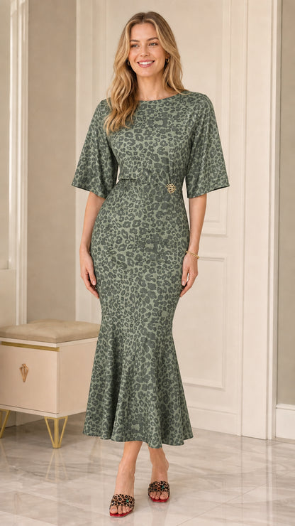 Model wearing Sage Green leopard print mermaid midi dress with waist accent