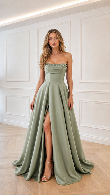 Model wearing sage green satin strapless evening gown