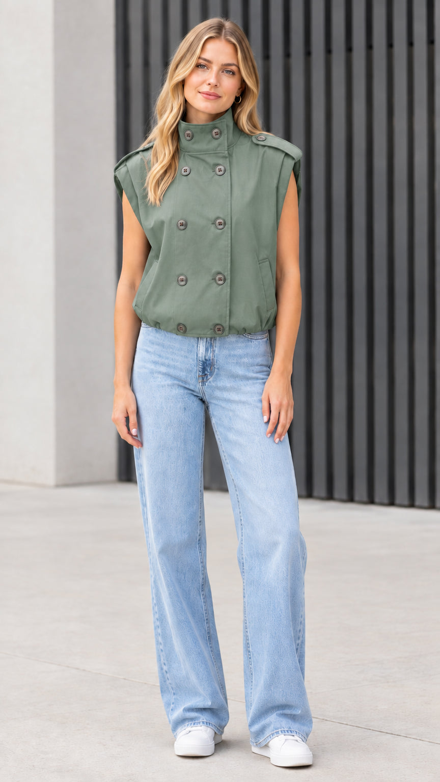 Front view of model wearing sage green double-breasted utility vest
