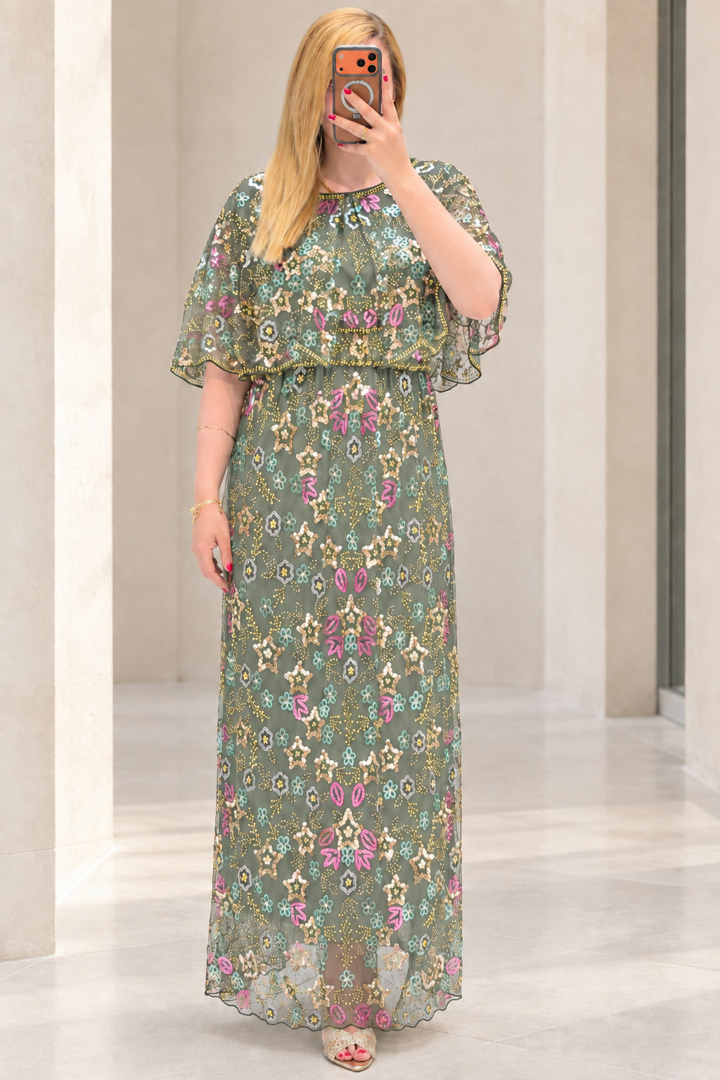 Front view of sage green floral sequin embroidered capelet maxi dress