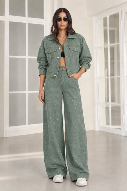 Model wearing sage green rhinestone denim jacket and wide-leg pants set