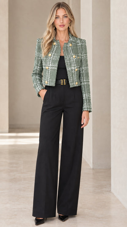 Model wearing sage green plaid cropped tweed jacket with black trousers