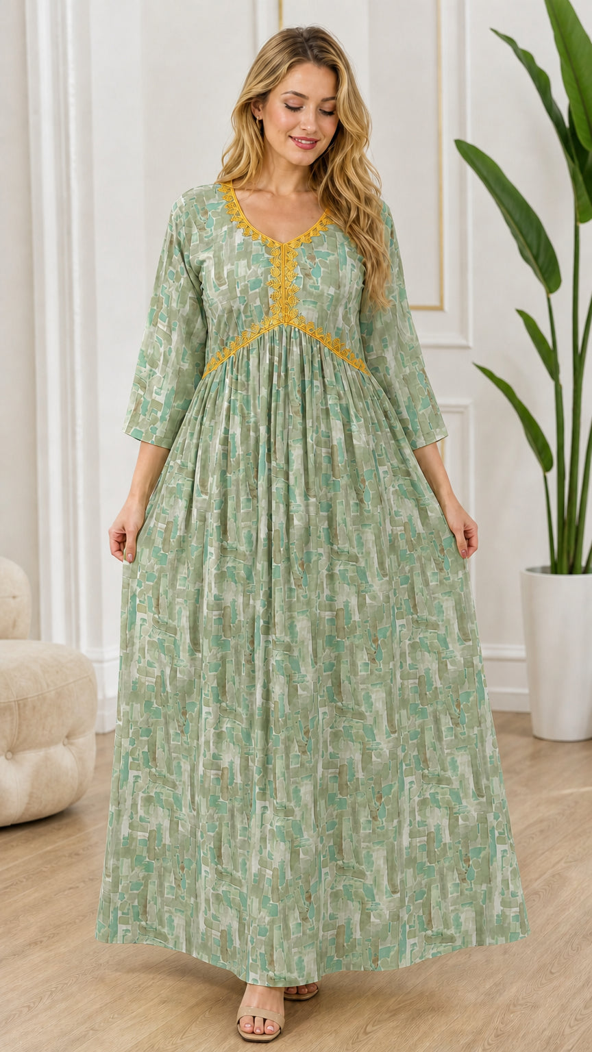 Full-length front view of model wearing sage green patterned empire waist maxi dress