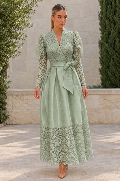 Woman wearing sage green floral lace puff sleeve satin evening maxi dress