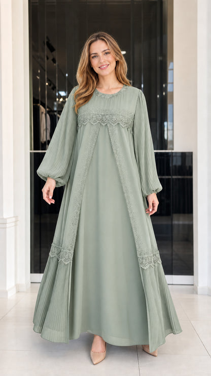 Front view of woman wearing sage green modest pleated sleeve lace maxi dress