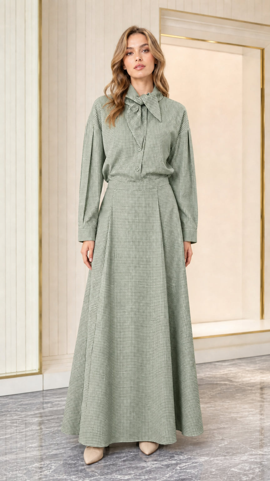 Model wearing sage green houndstooth long sleeve tie-neck maxi dress