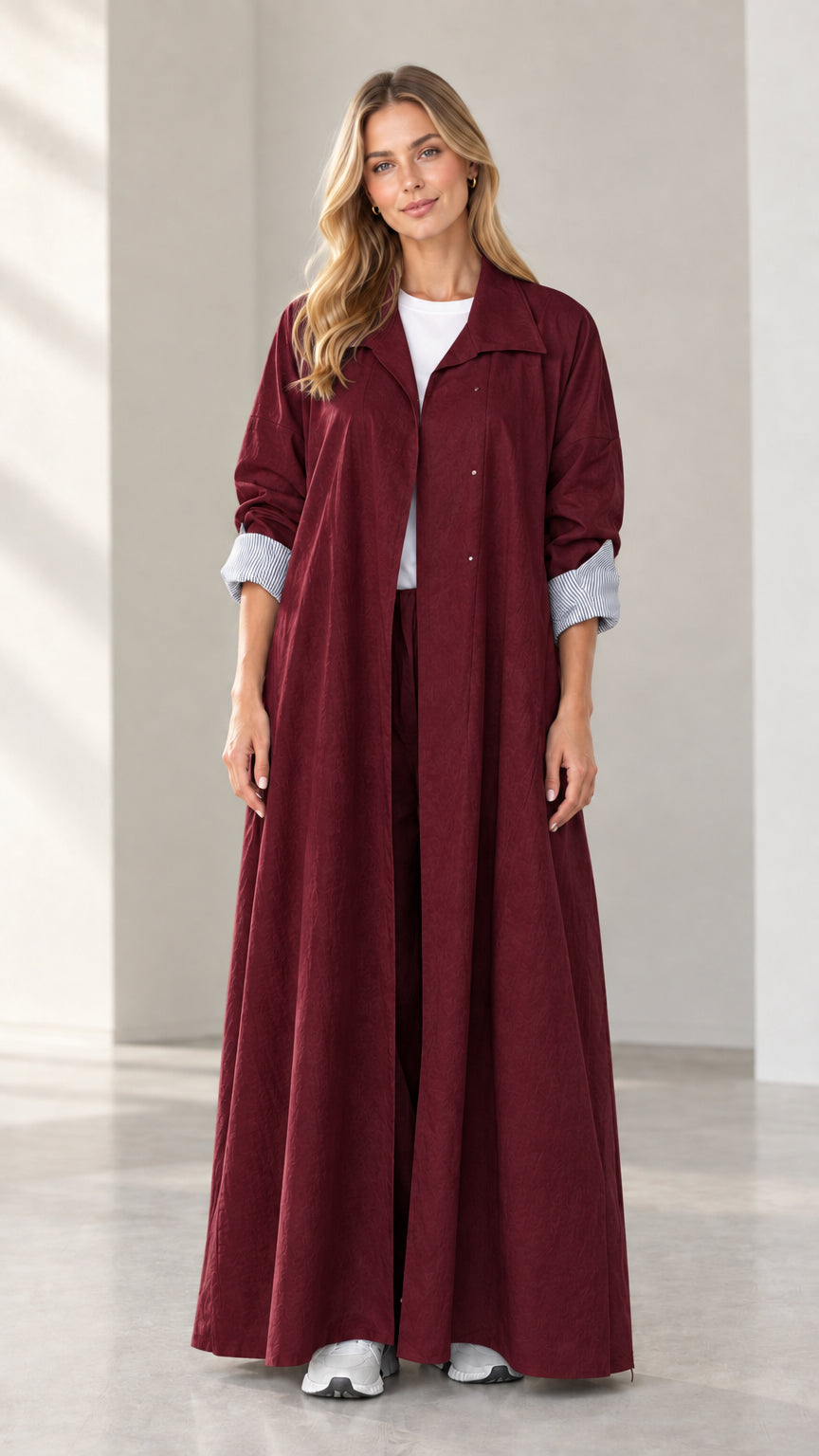 Full-length front view of woman wearing rich burgundy maxi duster trench coat