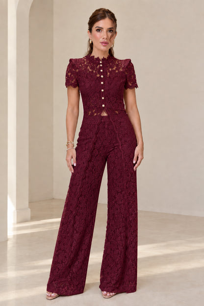 Model wearing burgundy red floral lace two-piece evening set
