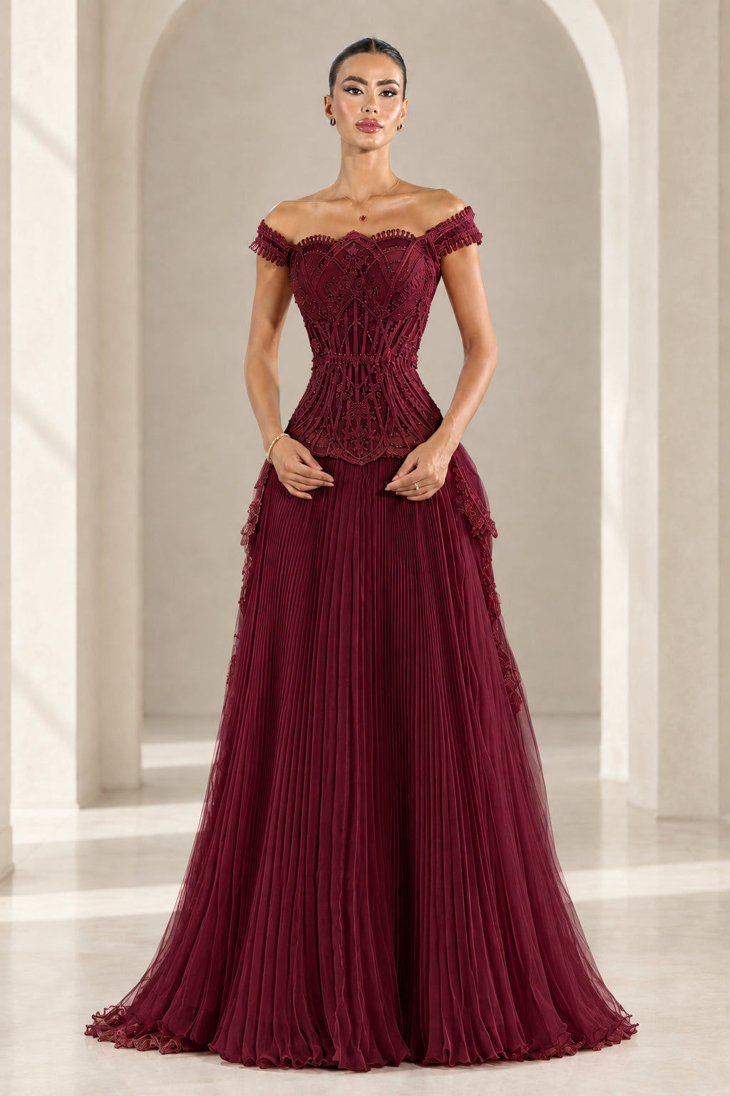 Front view of Burgundy off-the-shoulder pleated corset maxi gown