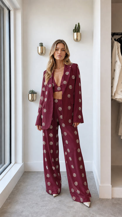Front view of woman wearing burgundy rhinestone embellished blazer set