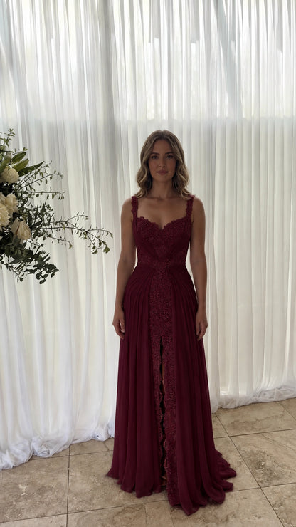 Front view of model wearing burgundy wine red chiffon evening gown