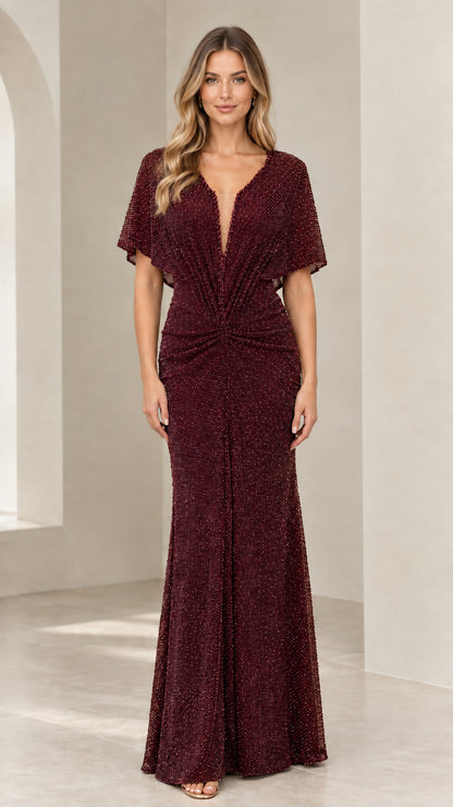 Model wearing Burgundy red glitter knit floor-length evening dress