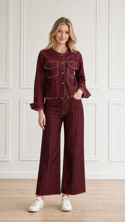 Model wearing burgundy red denim jacket and matching wide-leg trousers