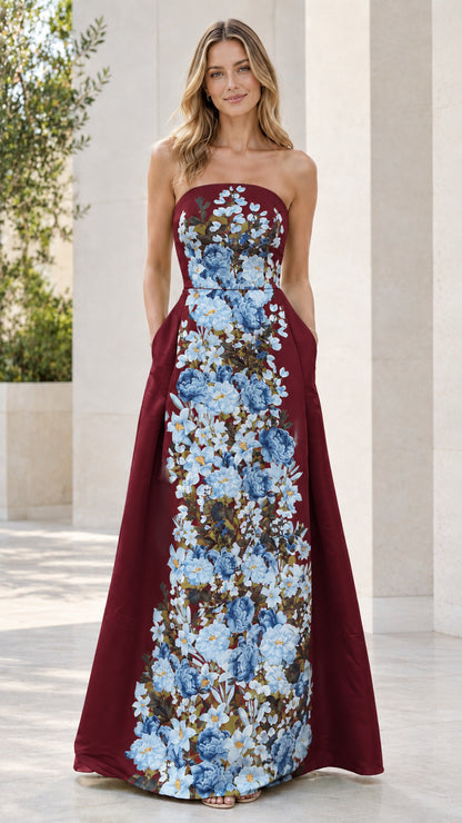 Front view of strapless burgundy evening gown with blue floral print panel