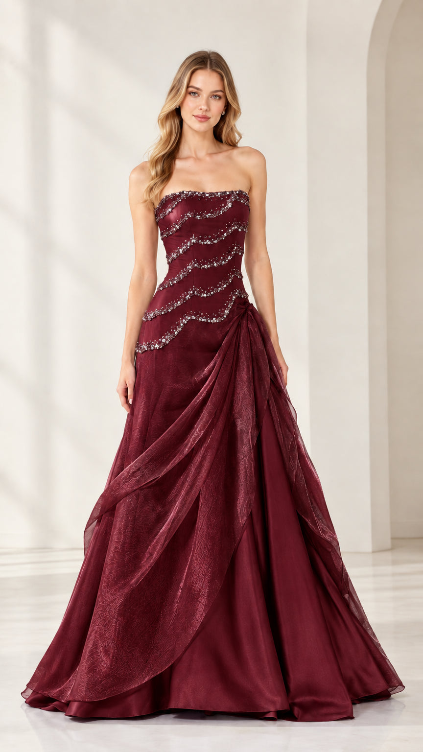 Full-length view of strapless beaded cascading formal ball gown in Burgundy