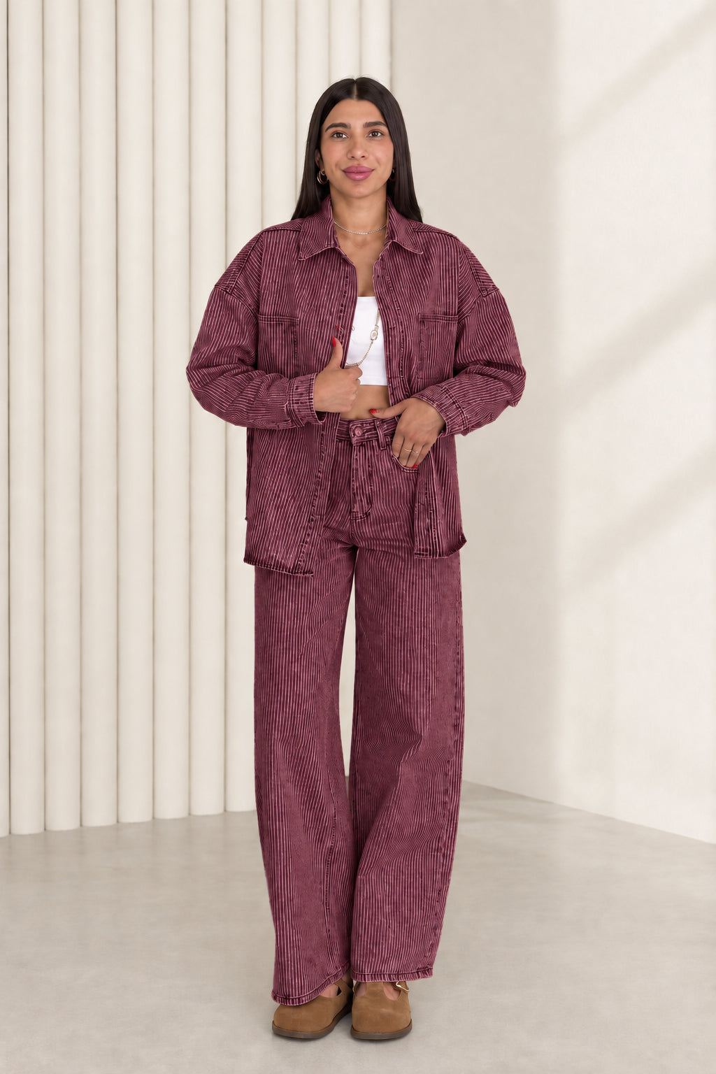Model wearing plum burgundy striped denim shacket and wide leg pants set