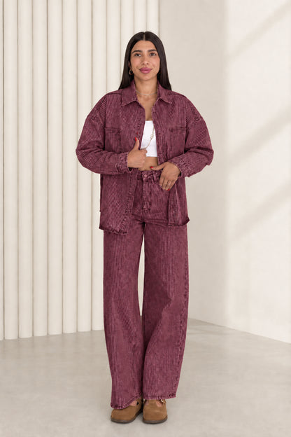Model wearing plum burgundy striped denim shacket and wide leg pants set