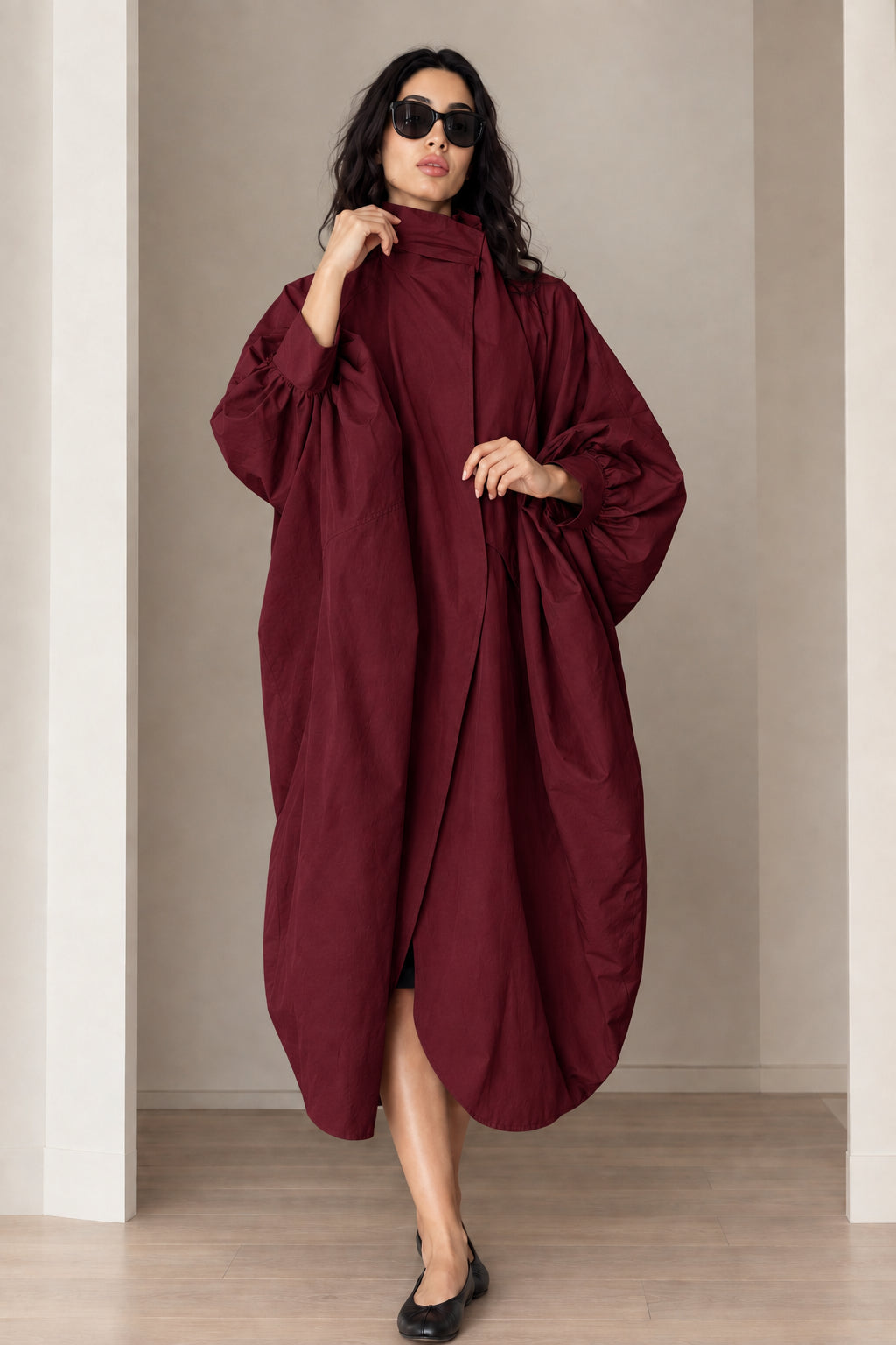 Model wearing burgundy wine red oversized cocoon duster coat