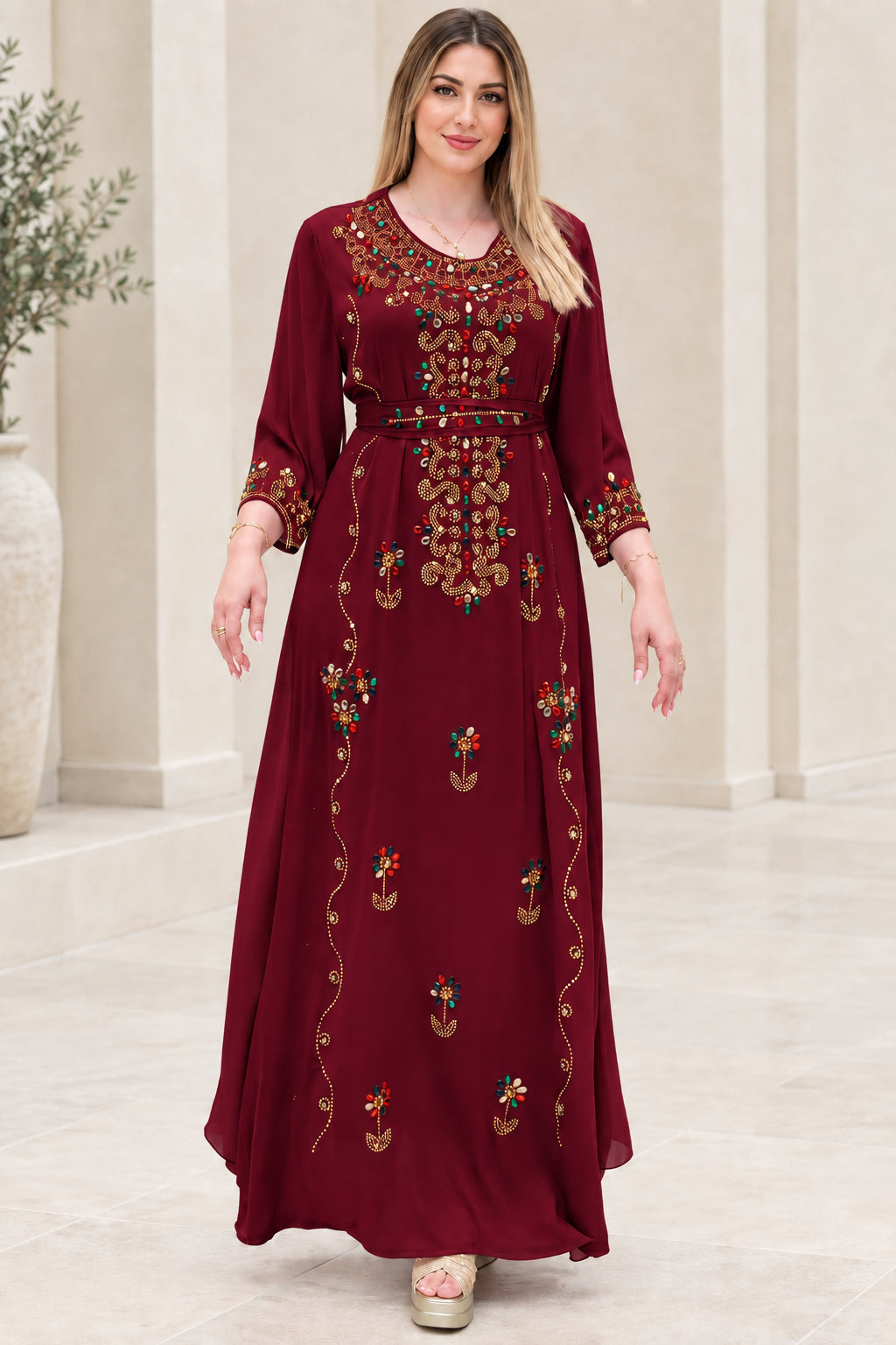 Front view of burgundy embellished kaftan maxi dress with tie belt