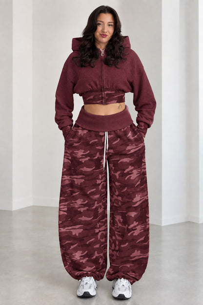 Model wearing Burgundy cropped zip hoodie and maroon camouflage wide-leg sweatpants set