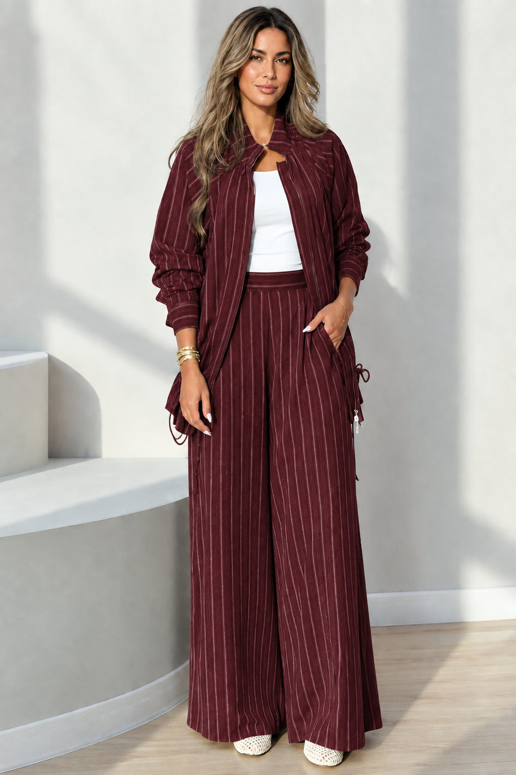 Full-length view of burgundy pinstripe casual jacket and pants matching set