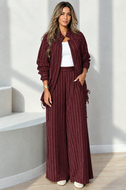 Full-length view of burgundy pinstripe casual jacket and pants matching set