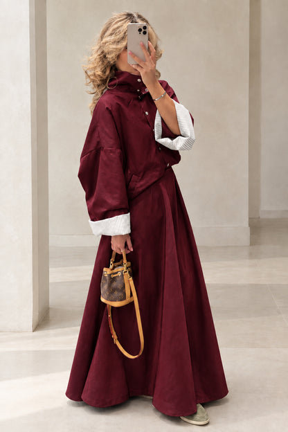 Full-length view of woman wearing Burgundy wine red jacket and maxi skirt set