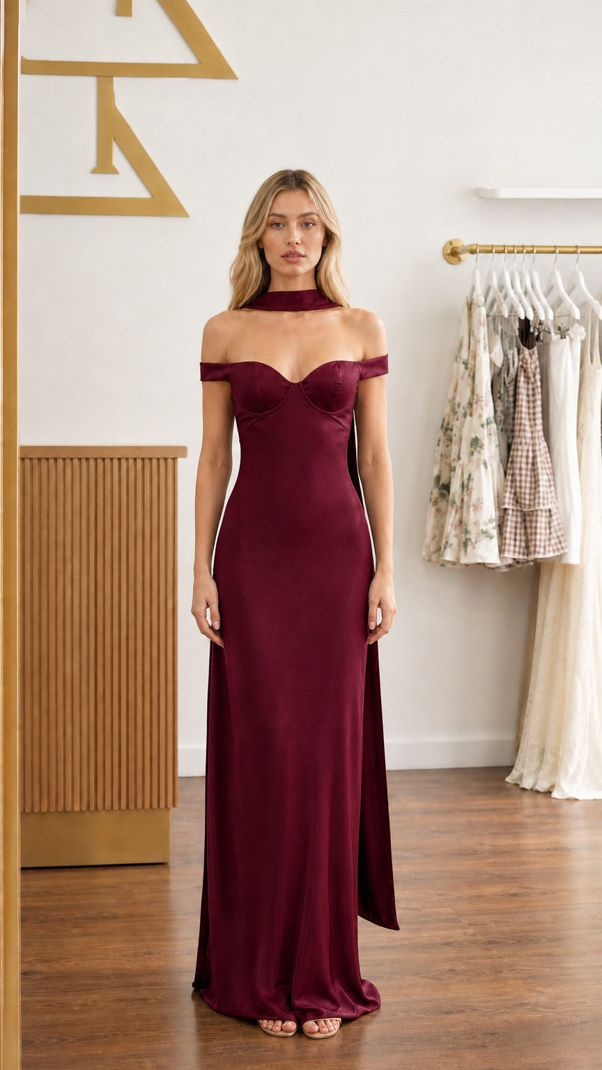 Model wearing burgundy wine satin off-shoulder bustier maxi dress - front view