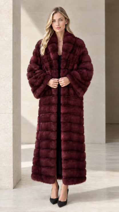 Model wearing rich burgundy wine horizontal paneled faux fur maxi coat