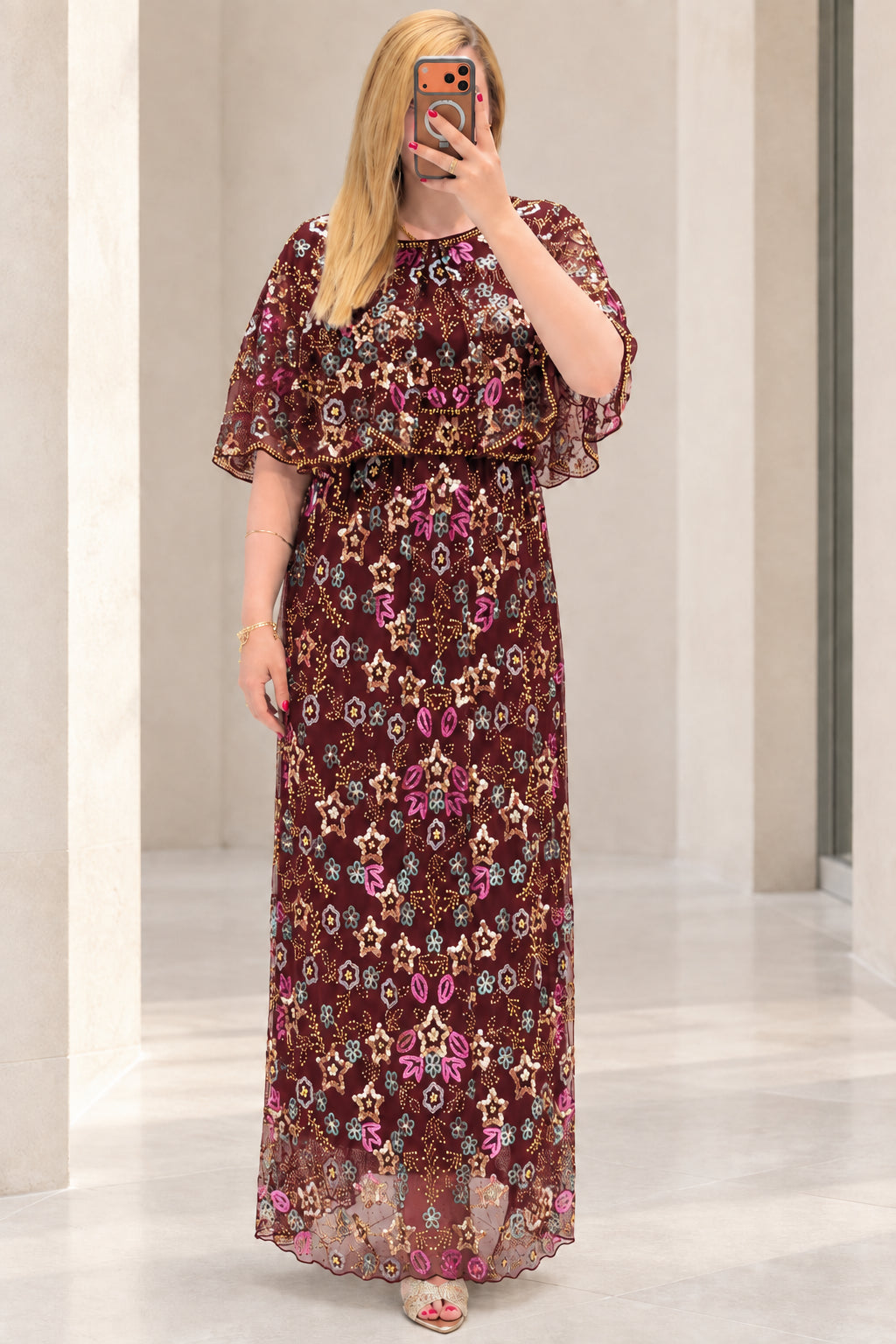 Front view of burgundy floral sequin embroidered capelet maxi dress