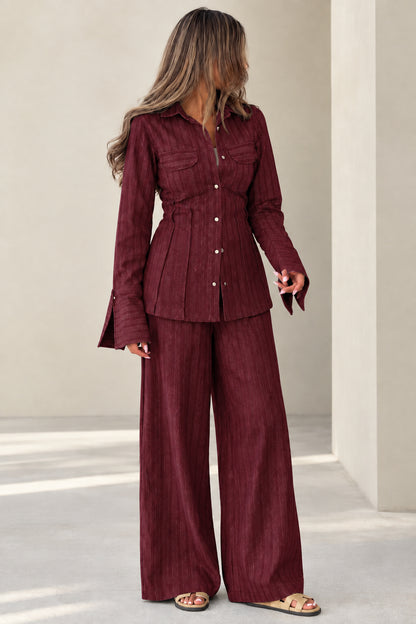 Full front view of women's burgundy wine textured button-front shirt and wide-leg pants set