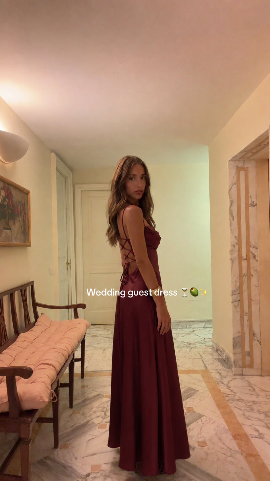 Model wearing Burgundy wine red satin backless maxi evening dress