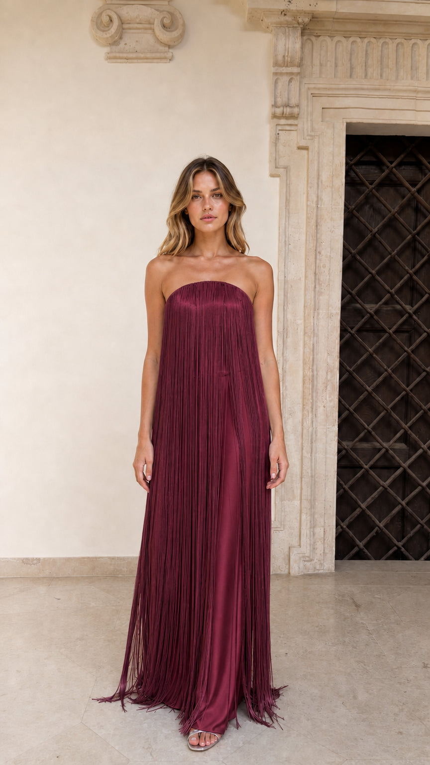 Model wearing Burgundy strapless fringe maxi dress