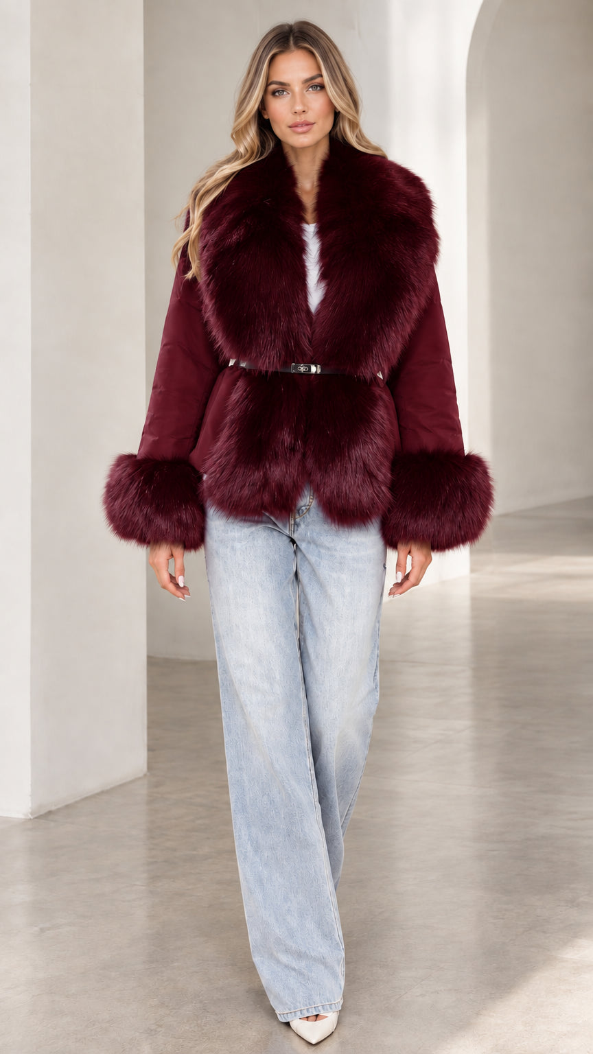 Model wearing burgundy wine red belted jacket with plush faux fur trim