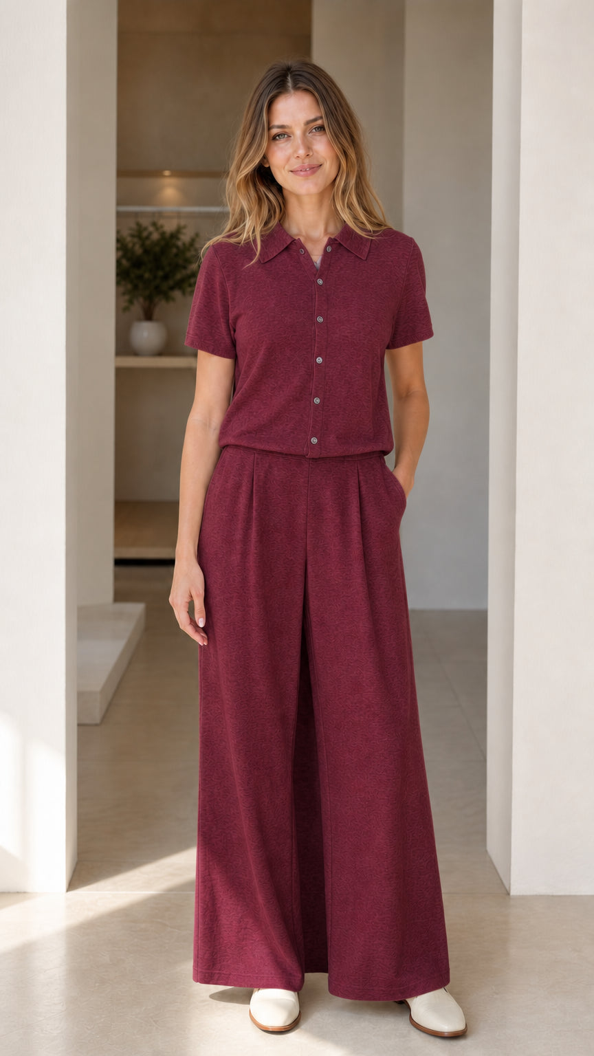 Full-length front view of burgundy short sleeve polo and wide-leg pants matching set
