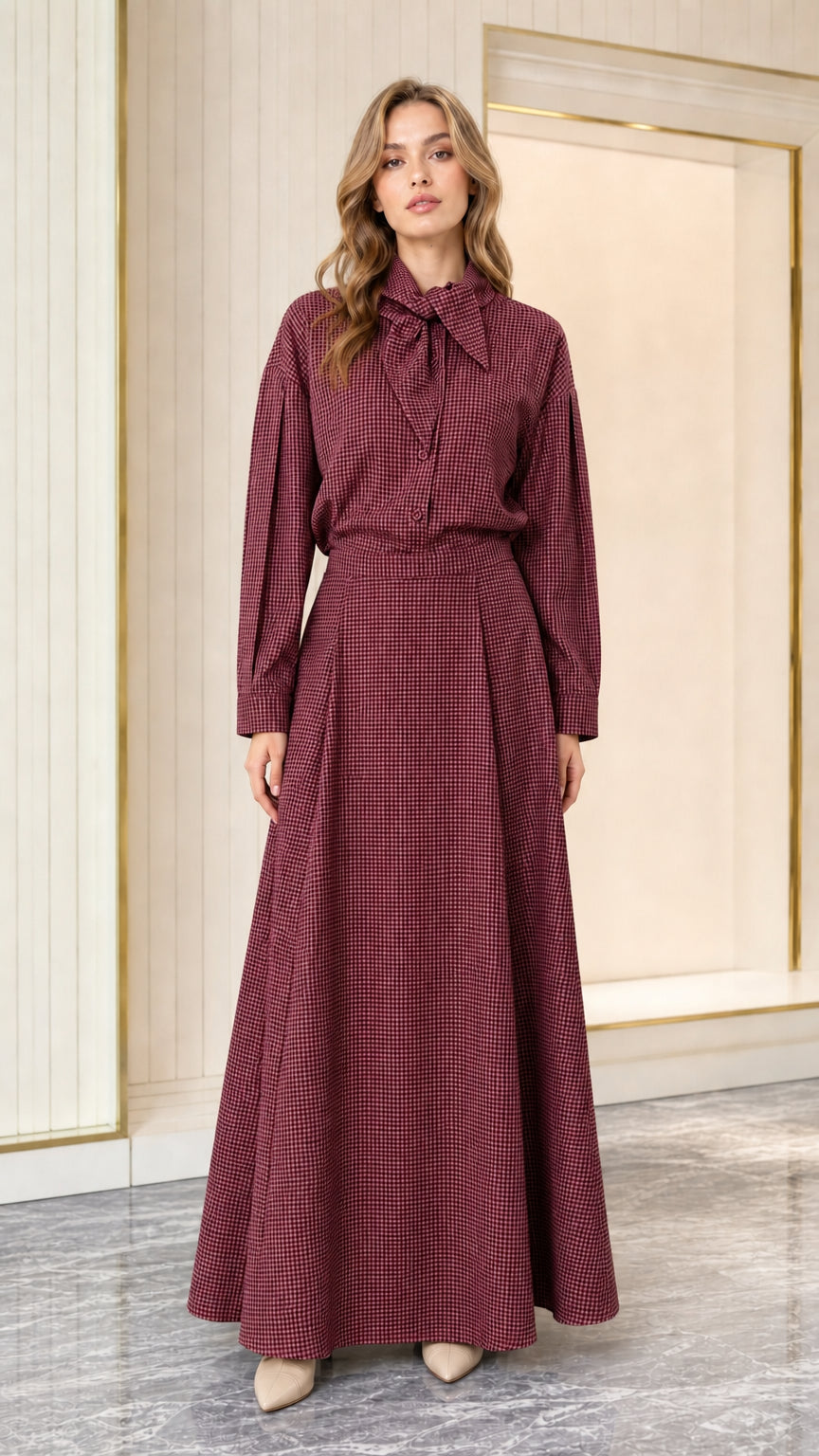 Model wearing burgundy red houndstooth long sleeve tie-neck maxi dress