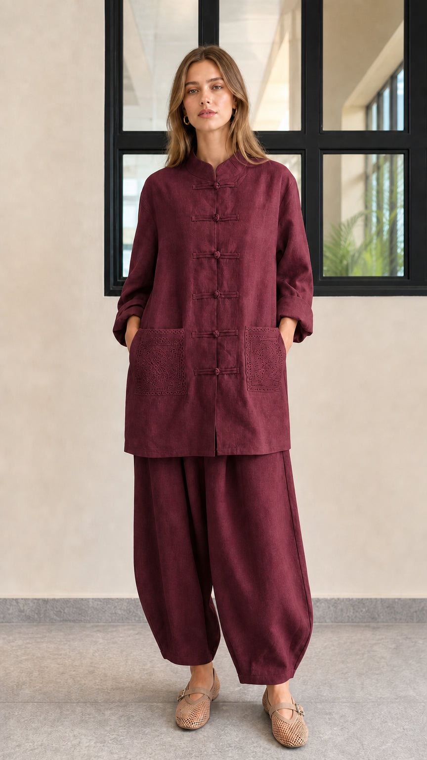 Front view of burgundy red linen blend frog button tunic and lantern pants set