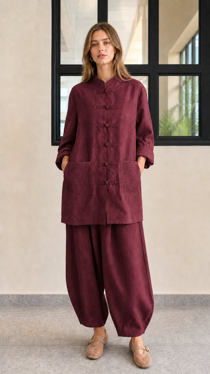 Front view of burgundy red linen blend frog button tunic and lantern pants set