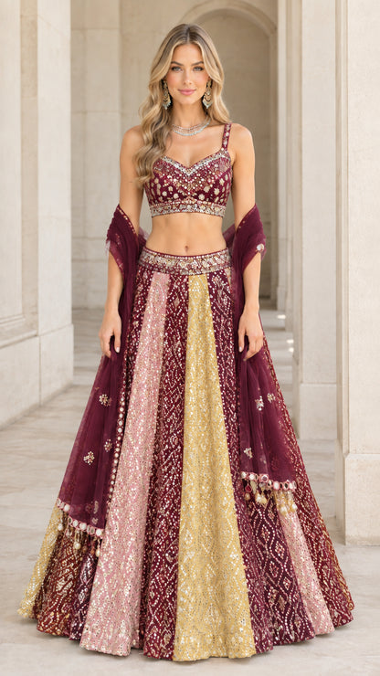 Model wearing wine and gold multi panel embroidered lehenga choli set