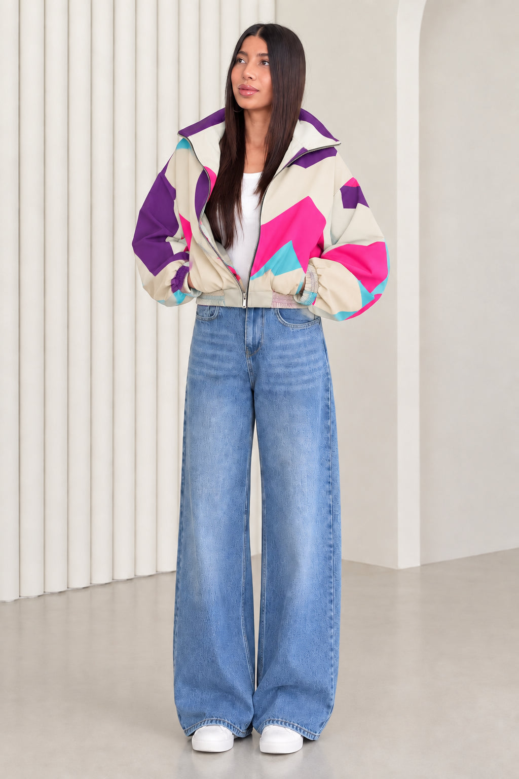 Woman wearing cream and purple contrast colorblock zip-up jacket