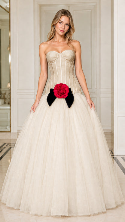 Model wearing elegant champagne strapless corset tulle ball gown