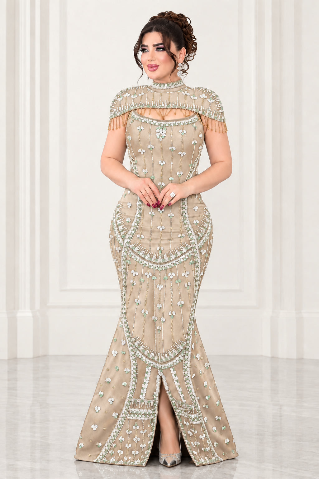 Full-length view of champagne gold rhinestone mermaid formal dress with capelet trim