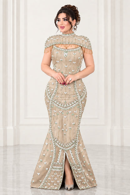 Full-length view of champagne gold rhinestone mermaid formal dress with capelet trim