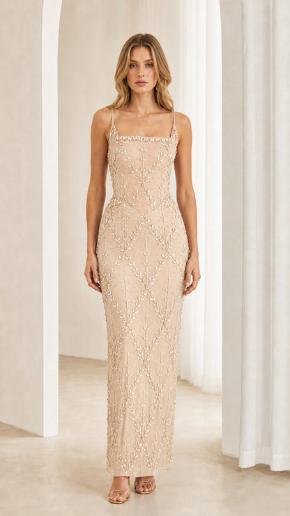 Front view of model wearing Champagne beige beaded corset maxi dress