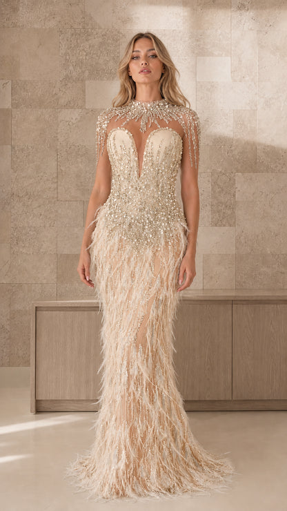 Front view of champagne beaded illusion feather evening gown
