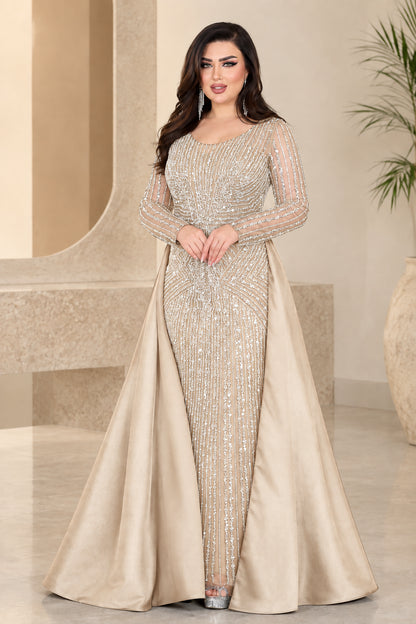 Champagne gold embellished evening gown with sheer long sleeves and satin overskirt