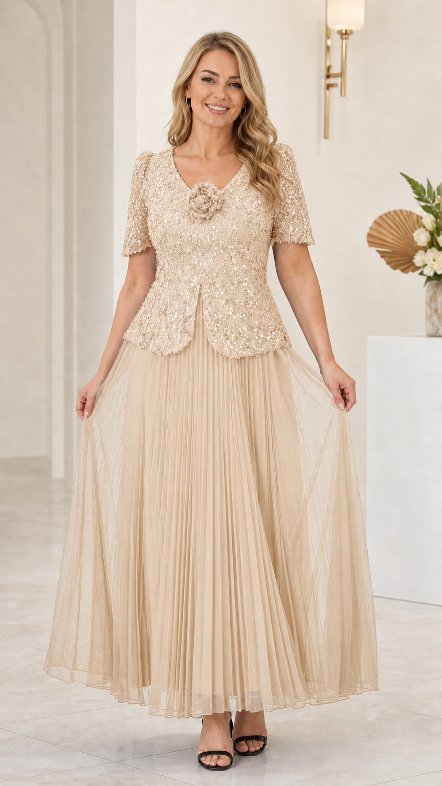 Front view of champagne gold sequin pleated mother of the bride dress