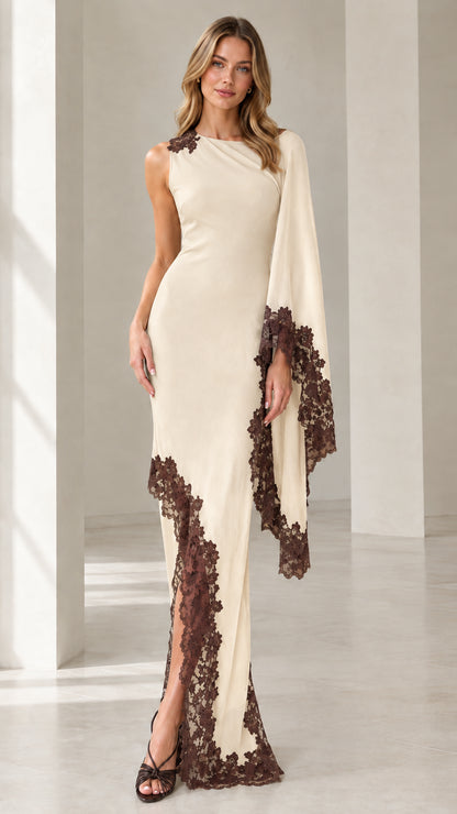 Front view of cream off-white asymmetric cape sleeve formal dress with contrast brown lace trim